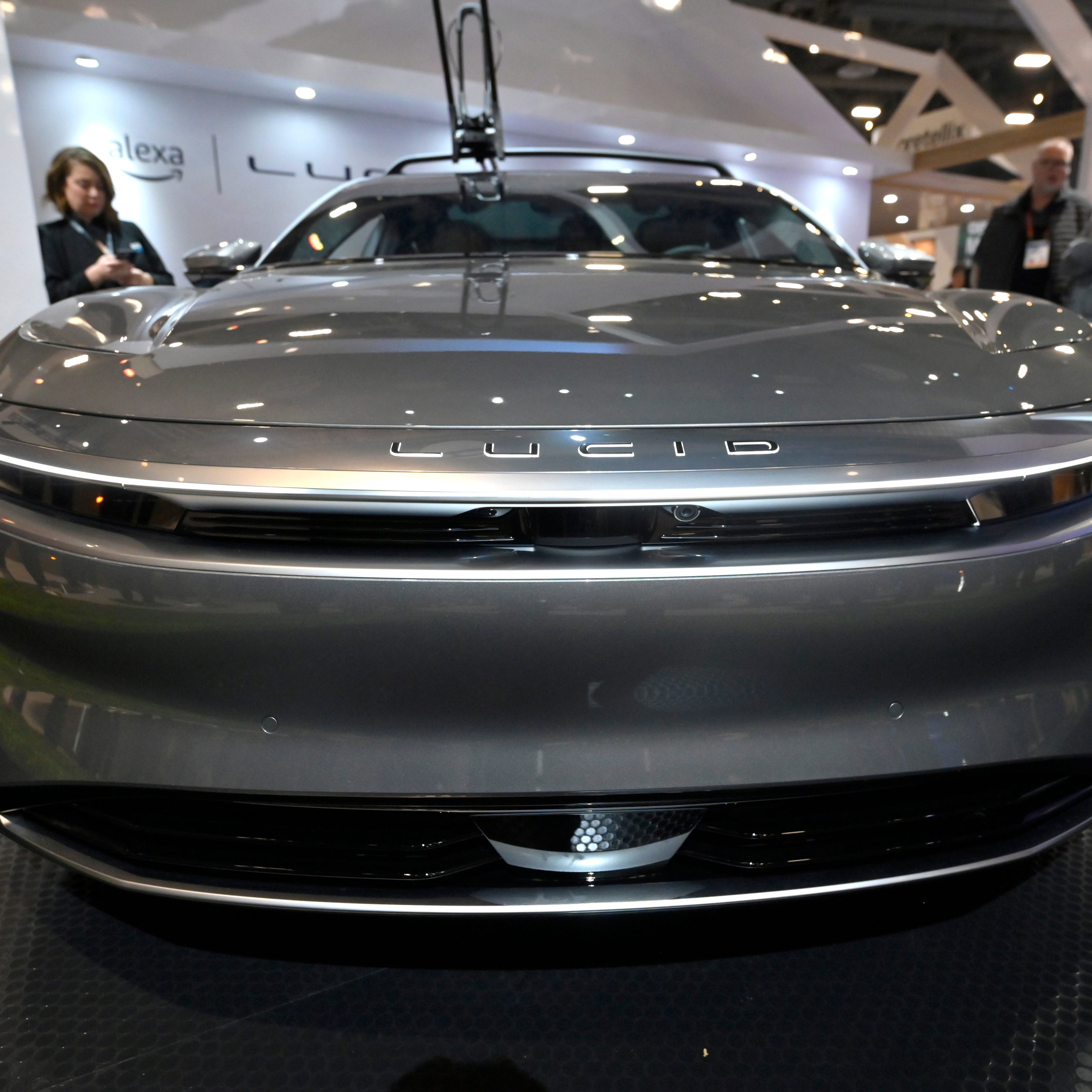 LAS VEGAS, NEVADA - JANUARY 05: A Lucid electric car equipped with Alexa Built-In is displayed at the Amazon for Automotive booth at CES 2023 at the Las Vegas Convention Center on January 05, 2023 in Las Vegas, Nevada. CES, the world's largest annual consumer technology trade show, runs through January 08 and features about 3,200 exhibitors showing off their latest products and services to more than 100,000 attendees.
