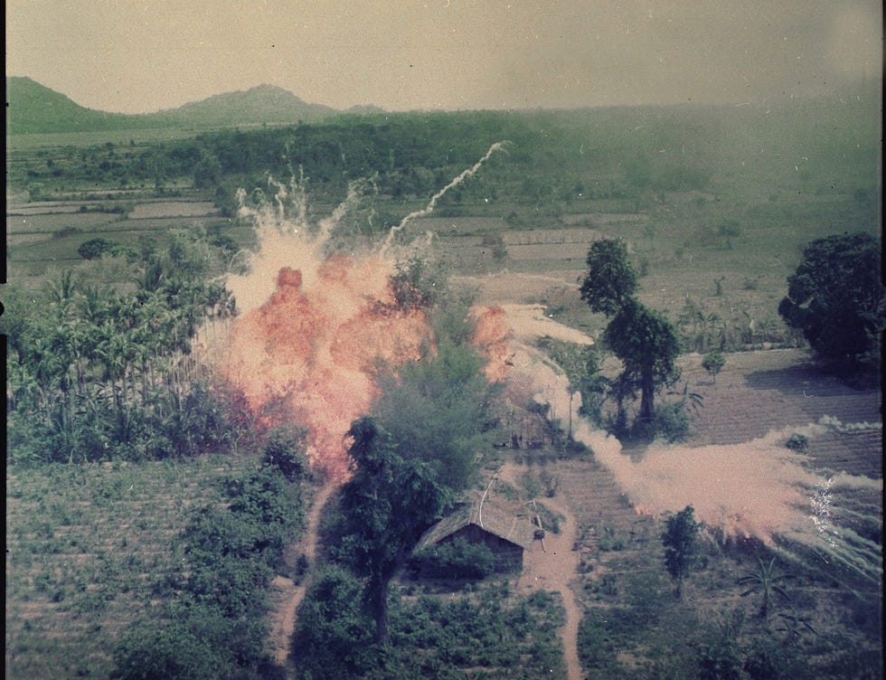 Napalm bombs explode on Viet Cong structures south of Saigon in the Republic of Vietnam in1965