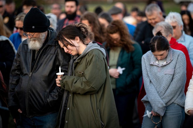 People pray during a community vigil held for the people killed during the Covenant School shooting on March 28, 2023, in Mount Juliet, Tenn.