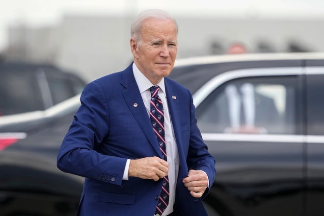 President Joe Biden walks to speak to reporters before boarding Air Force One at Raleigh-Durham International Airport in Morrisville, N.C., Tuesday, March 28, 2023, en route to Washington.