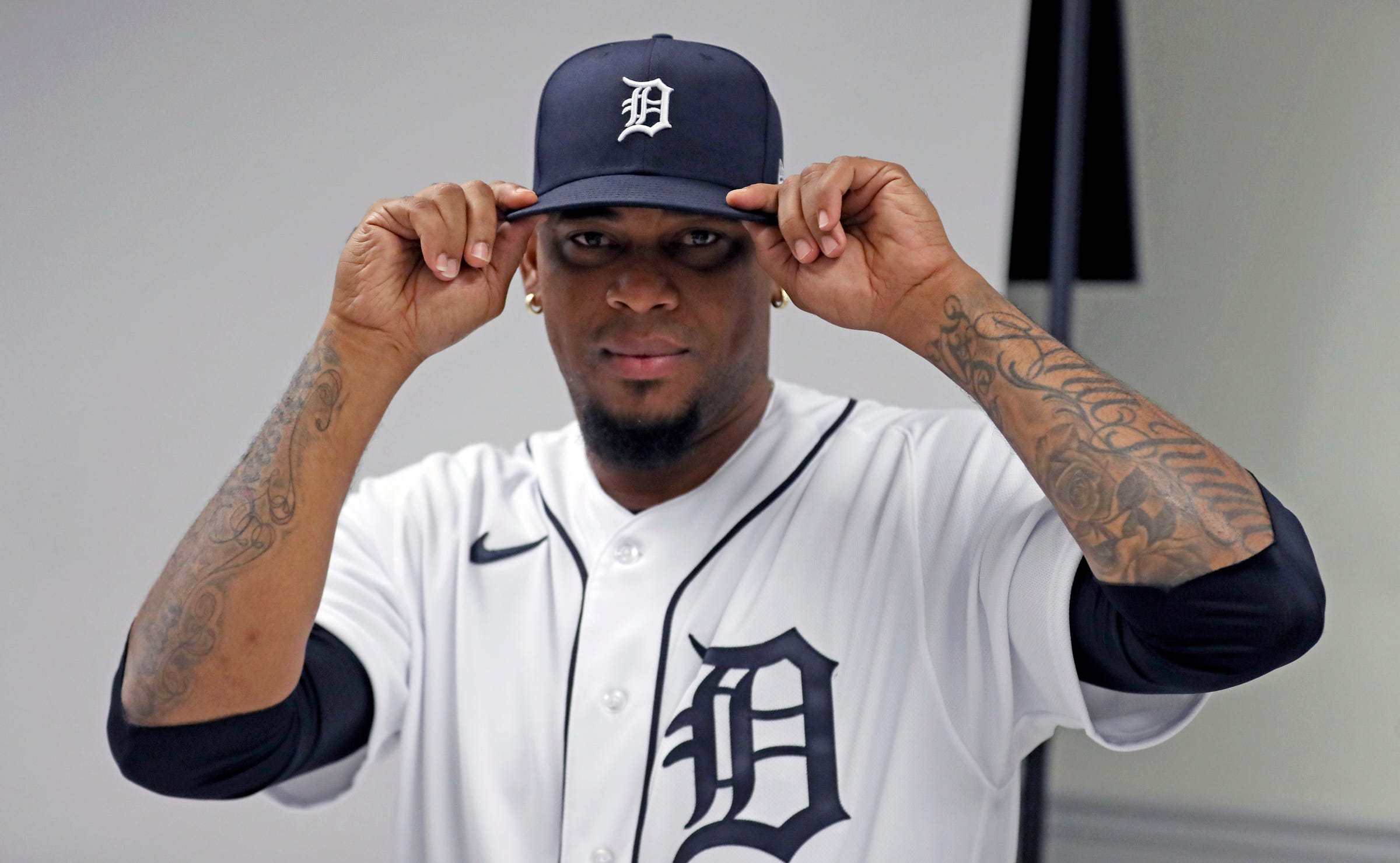 Detroit Tigers pitcher José Cisnero poses during picture day at spring training in Lakeland, Florida, on Sunday, Feb. 19, 2023.  Cisnero has also doesn't  know how many he has but his favorite is a clock set at 4:07, the time his first son, Jeyden, now 9, was born.