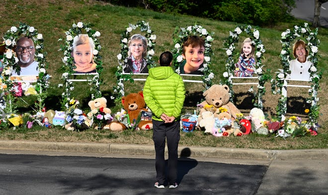 Photographs of Mike Hill, left, Evelyn Dieckhaus, Katherine Koonce, William Kinney, Hallie Scruggs, and Cynthia Peak were placed at a makeshift  memorial by the entrance to the Covenant School Thursday, March 30, 2023, in Nashville, Tenn.  