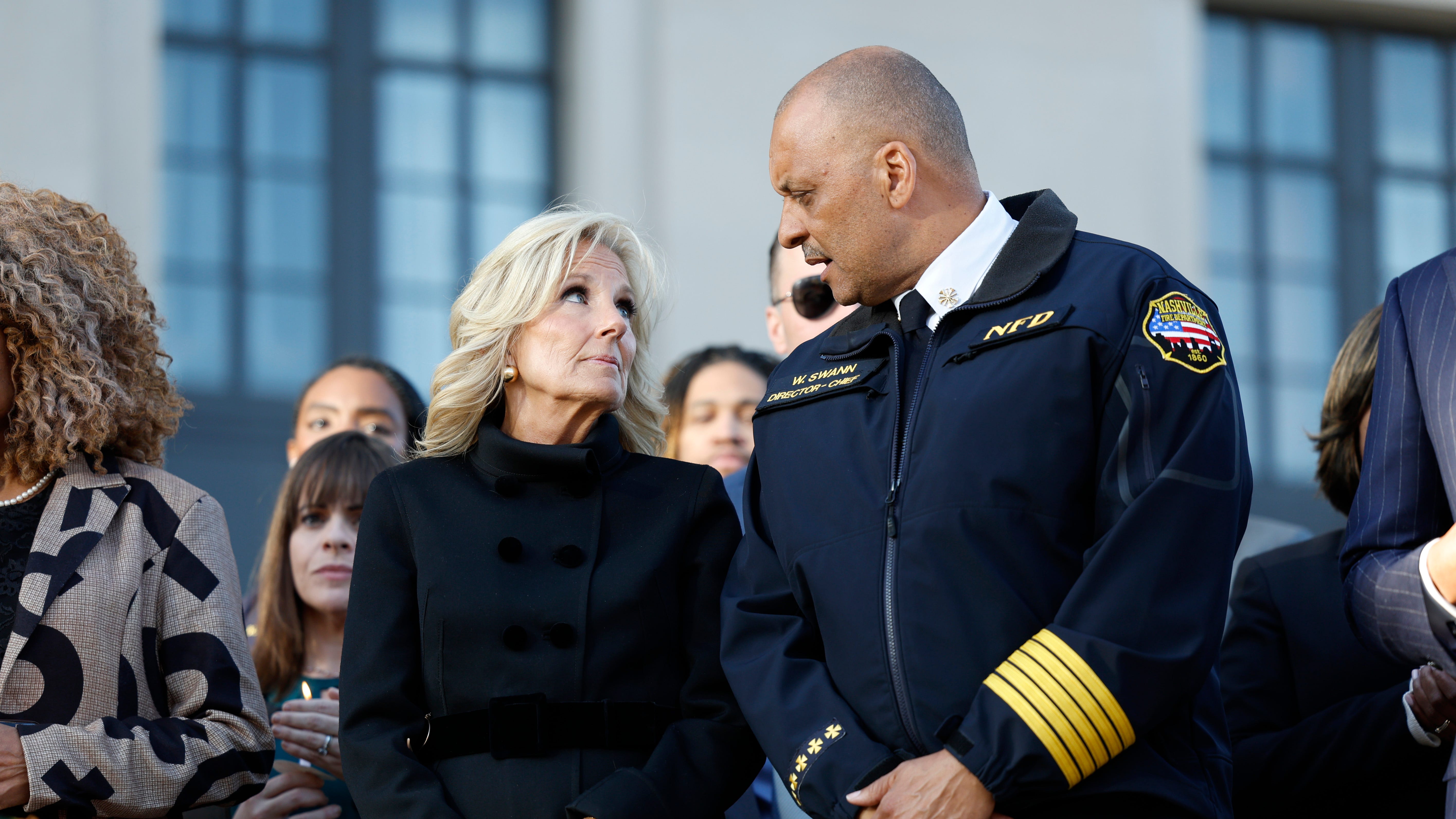 First Lady of the United States Jill Biden and Nashville Fire Department Chief William Swann attend a candlelight vigil to mourn and honor the lives of the victims, survivors and families of The Covenant School on March 29, 2023 in Nashville, Tennessee.