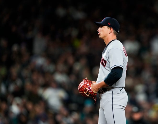 Cleveland Guardians relief pitcher James Karinchak reacts after being called for a pitch-clock violation during the eighth inning against the Seattle Mariners in an opening day baseball game Thursday, March 30, 2023, in Seattle. (AP Photo/Lindsey Wasson)