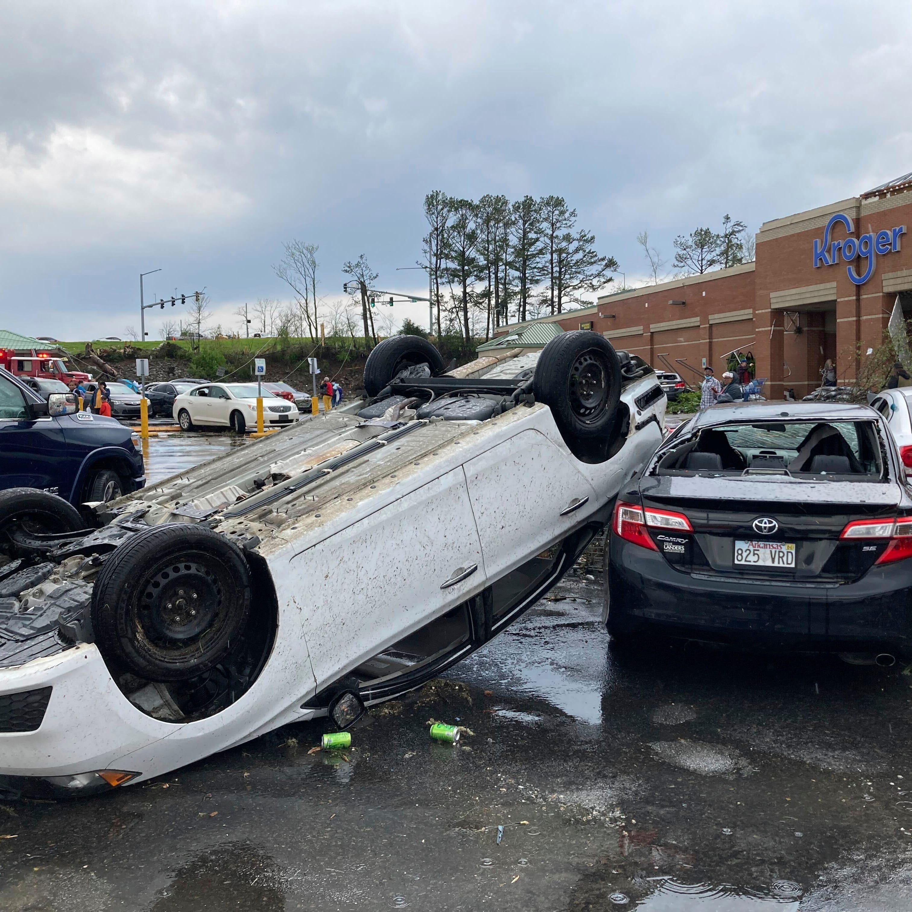 A car is upturned in a Kroger parking lot after a severe storm swept through Little Rock, Ark., Friday, March 31, 2023.