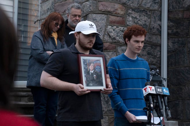 (Right) Aidan Solinas reads a statement about his brother David in front of his family's home in Oradell on Friday, March 31, 2023. Sgt. David Solinas Jr., 23, was killed during a medi-vac training mission near a base in Kentucky according to Aidan.