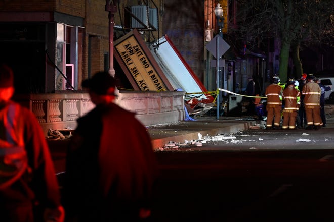 Authorities work the scene at the Apollo Theatre after a severe spring storm caused damage and injuries during a concert, late Friday, March 31, 2023, in Belvidere, Ill. (AP Photo/Matt Marton)