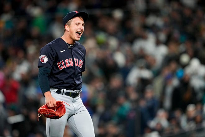 Cleveland Guardians relief pitcher James Karinchak reacts after striking out Seattle Mariners' Julio Rodriguez with two runners on base to end the eighth inning of a baseball game Saturday, April 1, 2023, in Seattle. The Guardians won 2-0. (AP Photo/Lindsey Wasson)