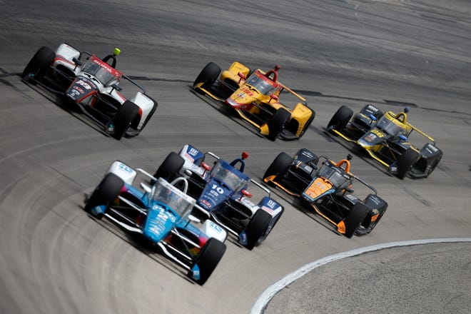 FORT WORTH, TEXAS - APRIL 02: Pato O'Ward, driver of the #5 Arrow McLaren Chevrolet, Roman Grosjean, driver of the #28 DHL Honda, Colton Herta, driver of the #26 Gainbridge Honda,
and David Malukas, driver of the #18 HMD Trucking Honda, race during the NTT IndyCar Series PPG 375 at Texas Motor Speedway on April 02, 2023 in Fort Worth, Texas.