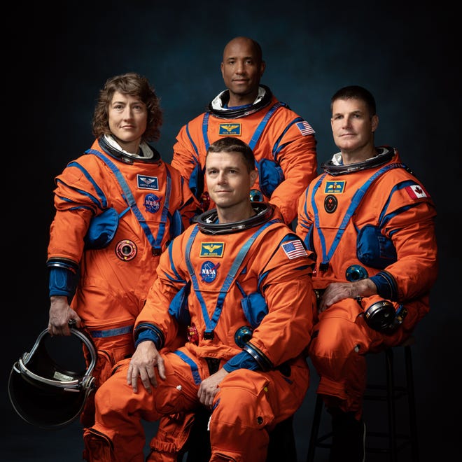 The crew of NASA's Artemis II mission are photographed suited up for the first human spaceflight mission to the moon since 1972. From the left NASA astronaut Christina Koch, NASA astronaut Victor Glover, Canadian Space Agency astronaut Jeremy Hansen, and at the center NASA astronaut Reid Wiseman.