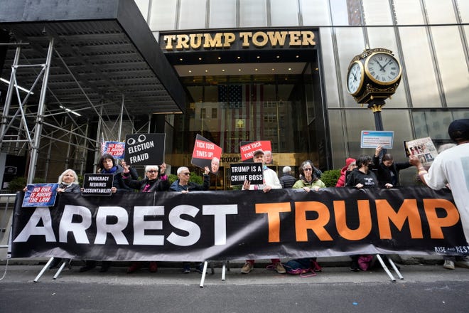 Protesters gather outside Trump Tower on Friday, March 31, 2023, in New York.  Former President Donald Trump was indicted by a Manhattan grand jury, Thursday, a historic reckoning after years of investigations into his personal, political and business dealings and an abrupt jolt to his bid to retake the White House.