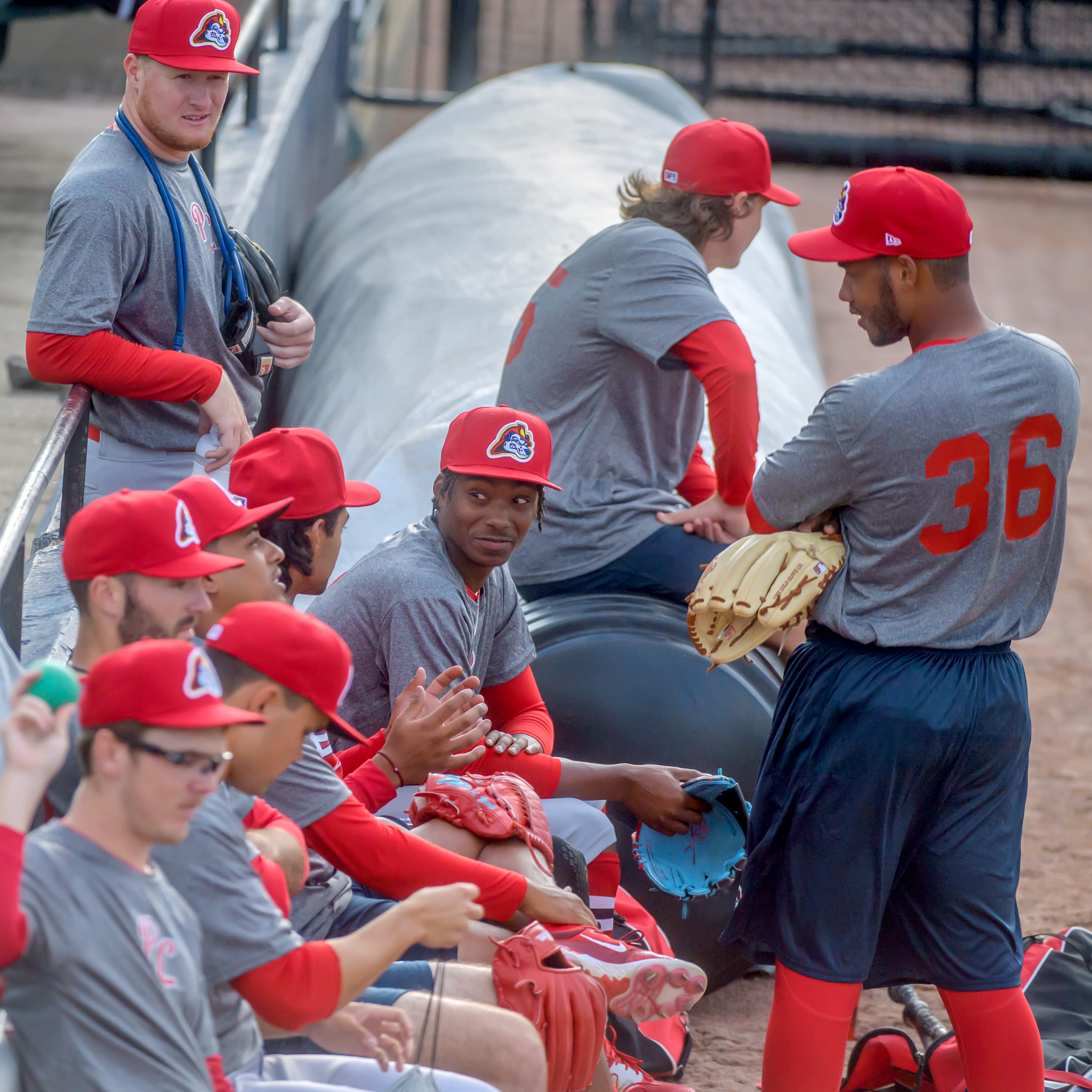 Members of the Peoria Chiefs take a break during practice Monday, April 3, 2023 at Dozer Park in Peoria.