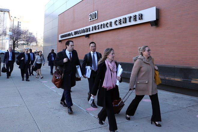 Fox News's legal team arrives for a hearing in its case with Dominion Voting Systems in Wilmington, Del., on Tuesday, March 21, 2023.