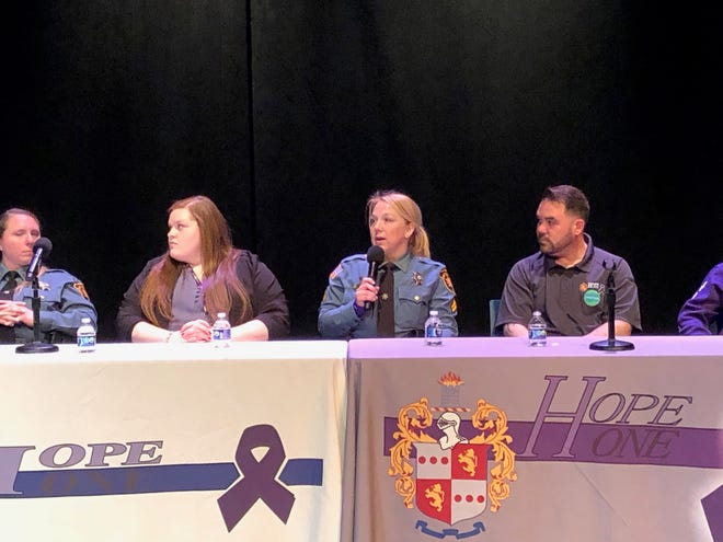 Cpl. Erica Valvano, center, coordinator of the Hope One program in the Morris County Sheriff's Office, speaks about the opioid crisis during a panel discussion at the Hope One Symposium marking the program's sixth anniversary at the County College of Morris Tuesday, April 4, 2023.