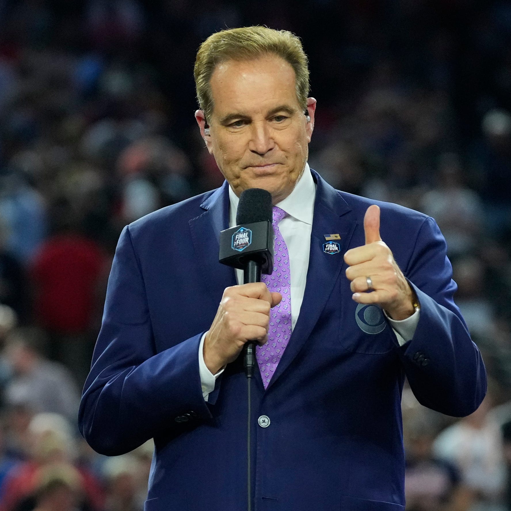 Jim Nantz on the podium after the national championship game of the 2023 NCAA Tournament.