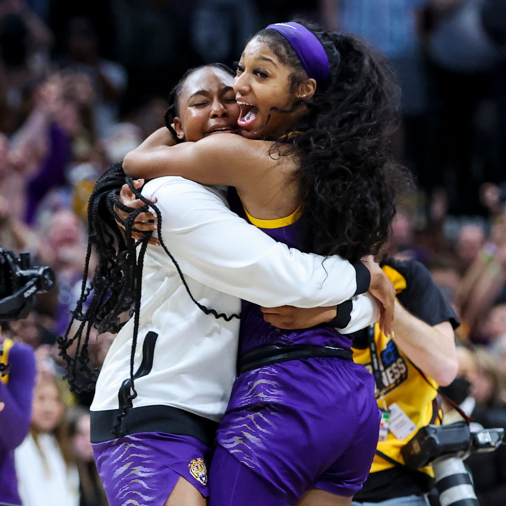 LSU forward Angel Reese celebrates after defeating Iowa on Sunday for the national championship.