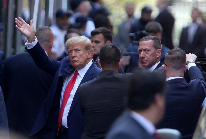 Former President Donald Trump arrives at Manhattan Criminal Court in New York City on Tuesday.