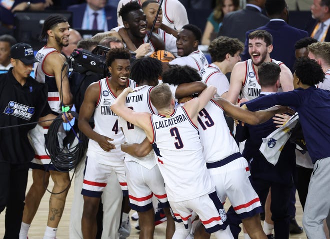 Connecticut players celebrate after defeating San Diego State in the national championship game of the 2023 NCAA men's tournament at NRG Stadium.