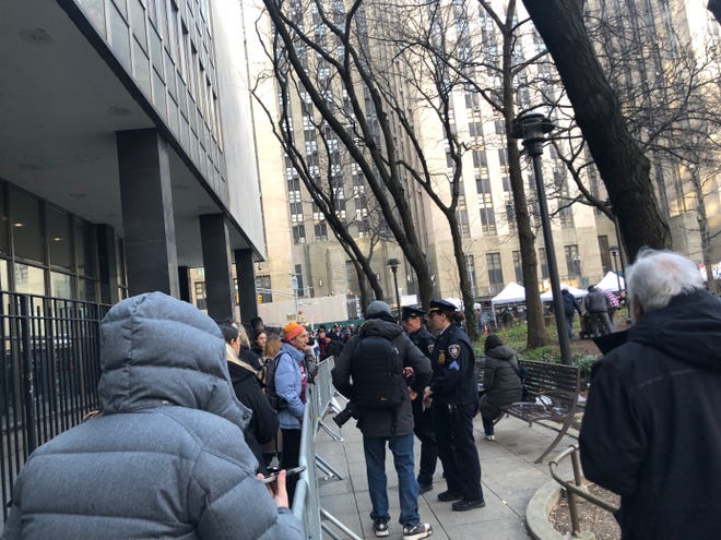 Media members line up outside the courthouse ahead of former  President Donald Trump's arraignment in Manhattan on April 4, 2023.