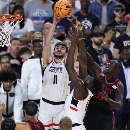 Connecticut forward Alex Karaban (11) goes up for a rebound against San Diego State during the national championship game of the 2023 NCAA men's tournament at NRG Stadium.