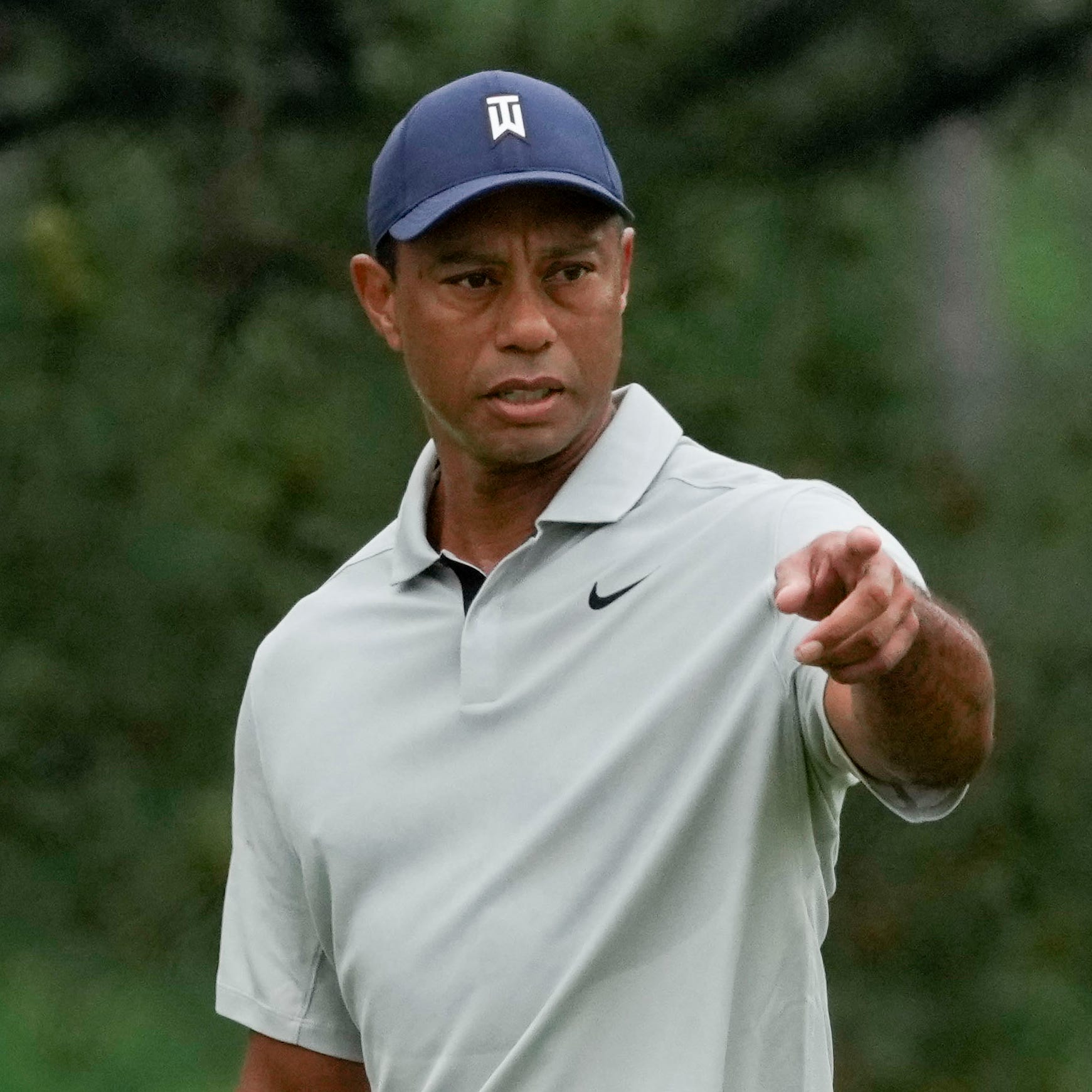 Tiger Woods, right, and Justin Thomas, left, prepare to putt on the seventh green during Tuesday's practice round for the 2023 Masters Tournament.