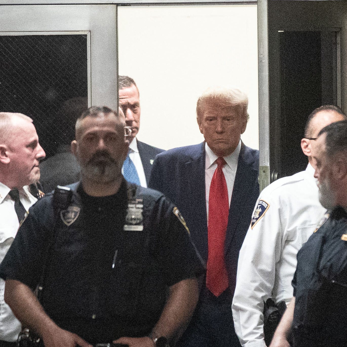 Apr 4, 2023; New York, NY, USA; Former President Donald Trump enters court for his arraignment on April 4, 2023. Mandatory Credit: Seth Harrison-USA TODAY