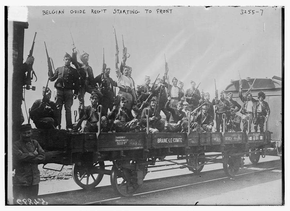 Photograph shows Belgian soldiers in rail road car during World War I.