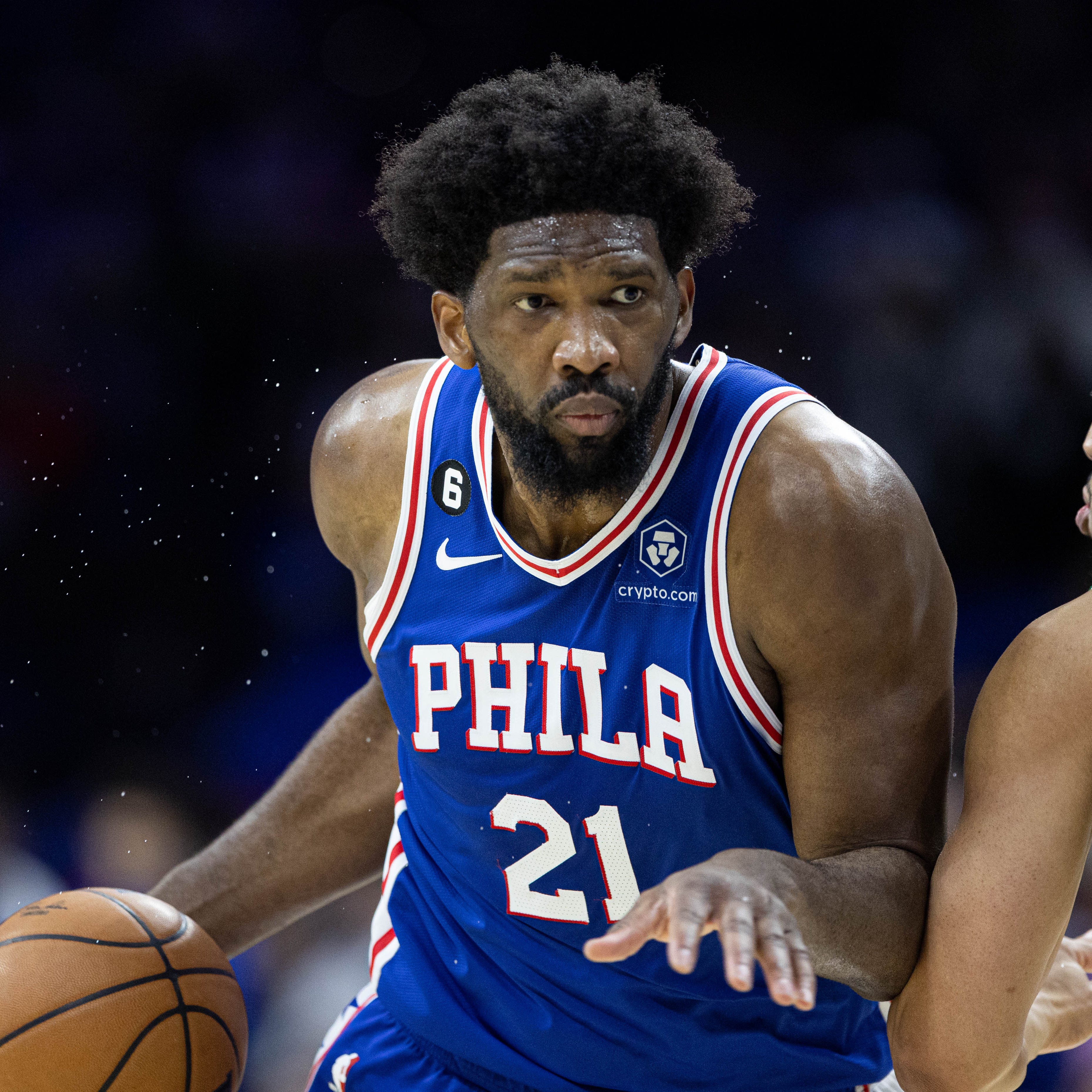 Philadelphia 76ers center Joel Embiid drives against Boston Celtics forward Grant Williams.