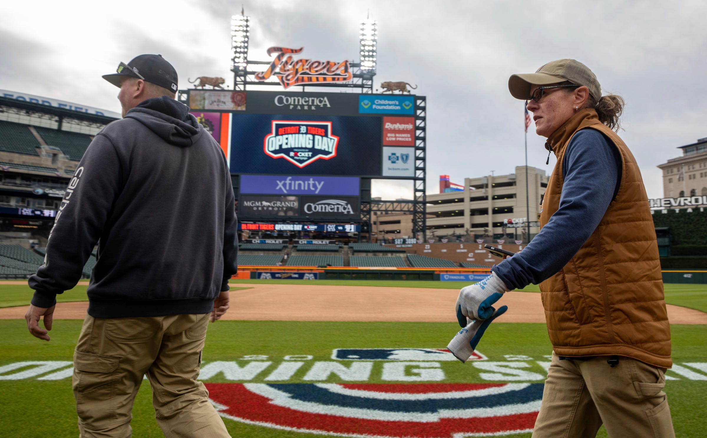 Heather Nabozny, the head groundkeeper for the Detroit Tigers, walks on the field during the Detroit Tigers' Opening Day at Comerica Park in Detroit on Thursday, April 6, 2023.