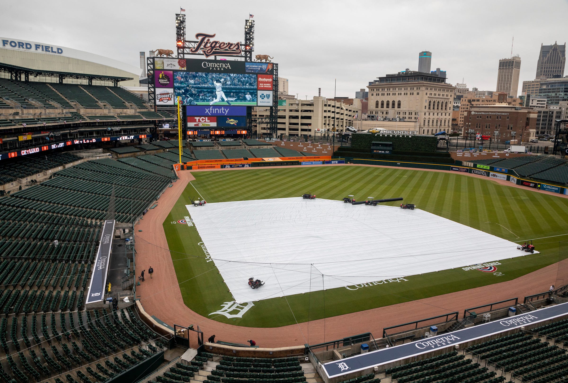 Over a dozen people work to prepare Comerica Park ahead of Opening Day on Tuesday, April 4, 2023.