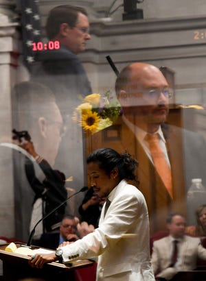 Republican lawmakers, including House Speaker Cameron Sexton, are seen reflected in a pane of glass as Justin Jones, D-Nashville, speaks ahead of a vote to expel him from the House of Representatives at the Tennessee State Capitol in Nashville, Tenn., on Thursday, April 6, 2023. 