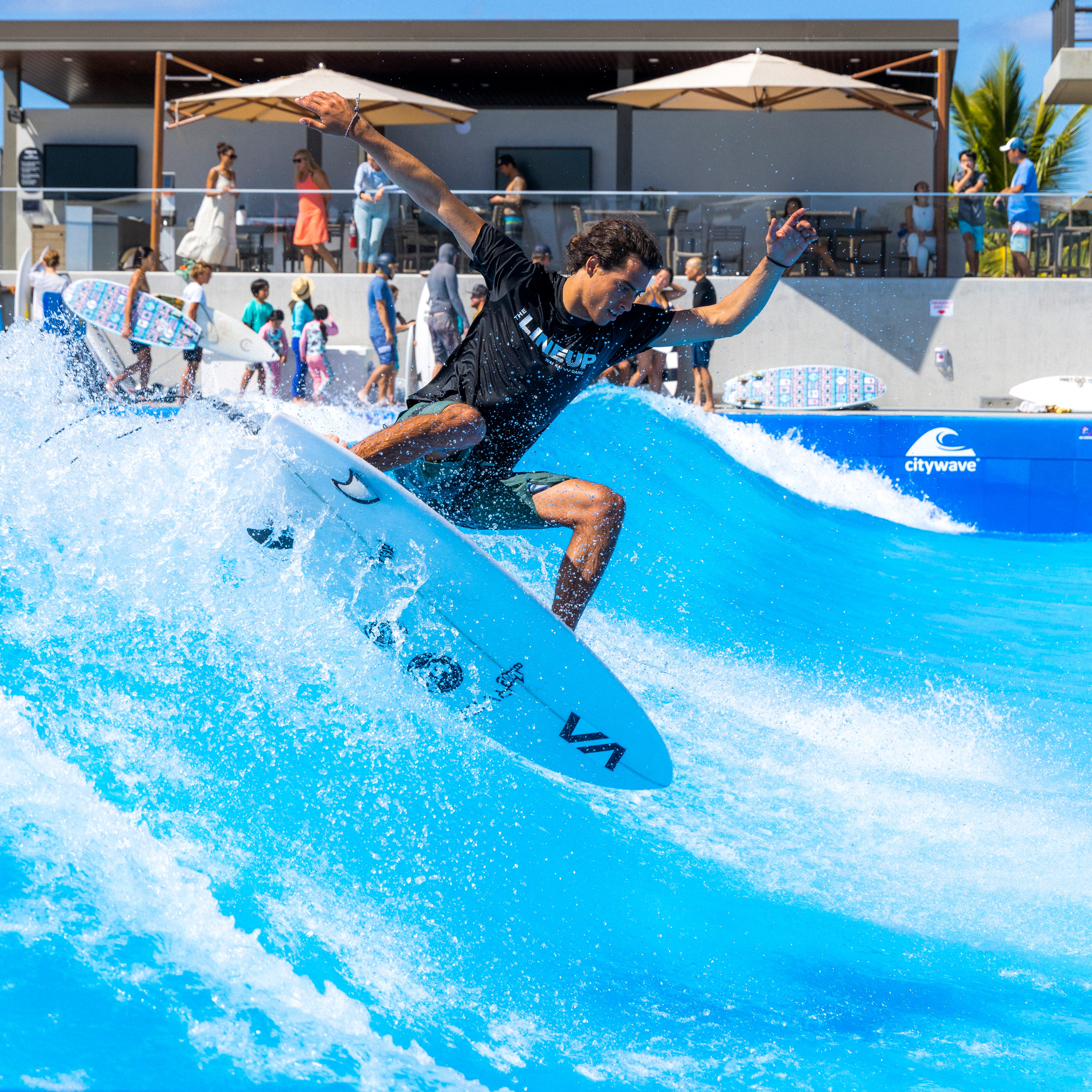 A surfer rips on the wave pool, which is basically limited to exclusively shortboards.