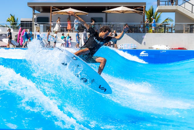 A surfer rips on the wave pool, which is basically limited to shortboards exclusively.