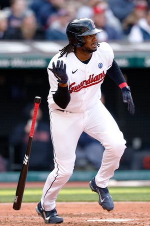 Josh Bell heads for first after hitting an RBI single for the Guardians during the third inning of their home opener, Friday, April 7, 2023, in Cleveland.