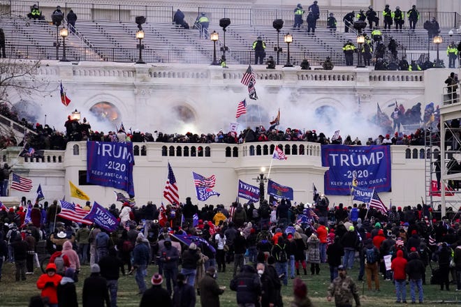 In this Wednesday, Jan. 6, 2021, file photo, violent rioters storm the Capitol, in Washington.