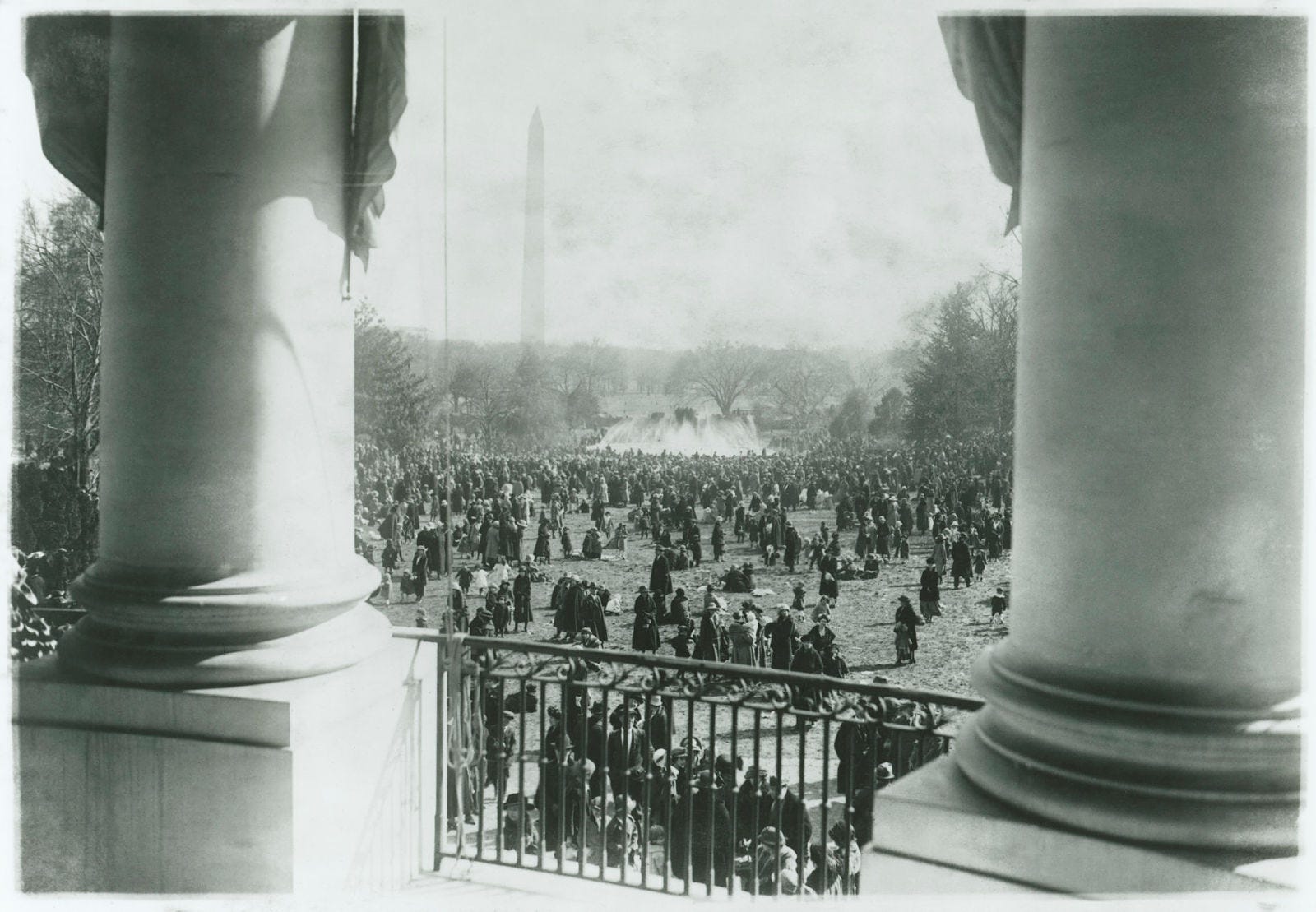 This is a photograph taken from the South Portico on April 2, 1923, of the crowds gathered on the South Lawn for the White House Easter Egg Roll.
