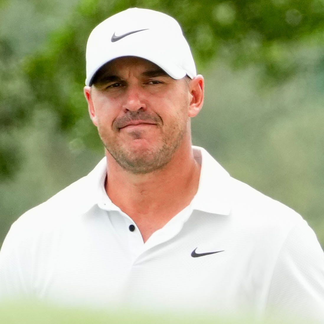 Brooks Koepka walks up the 18th hole during the second round of The Masters.