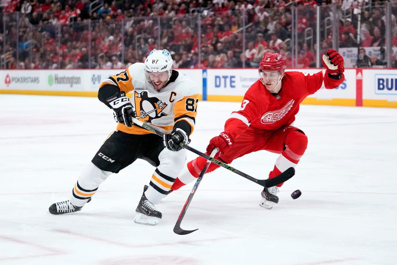 Pittsburgh Penguins center Sidney Crosby (87) shoots as Detroit Red Wings' Simon Edvinsson (3) defends in the second period.