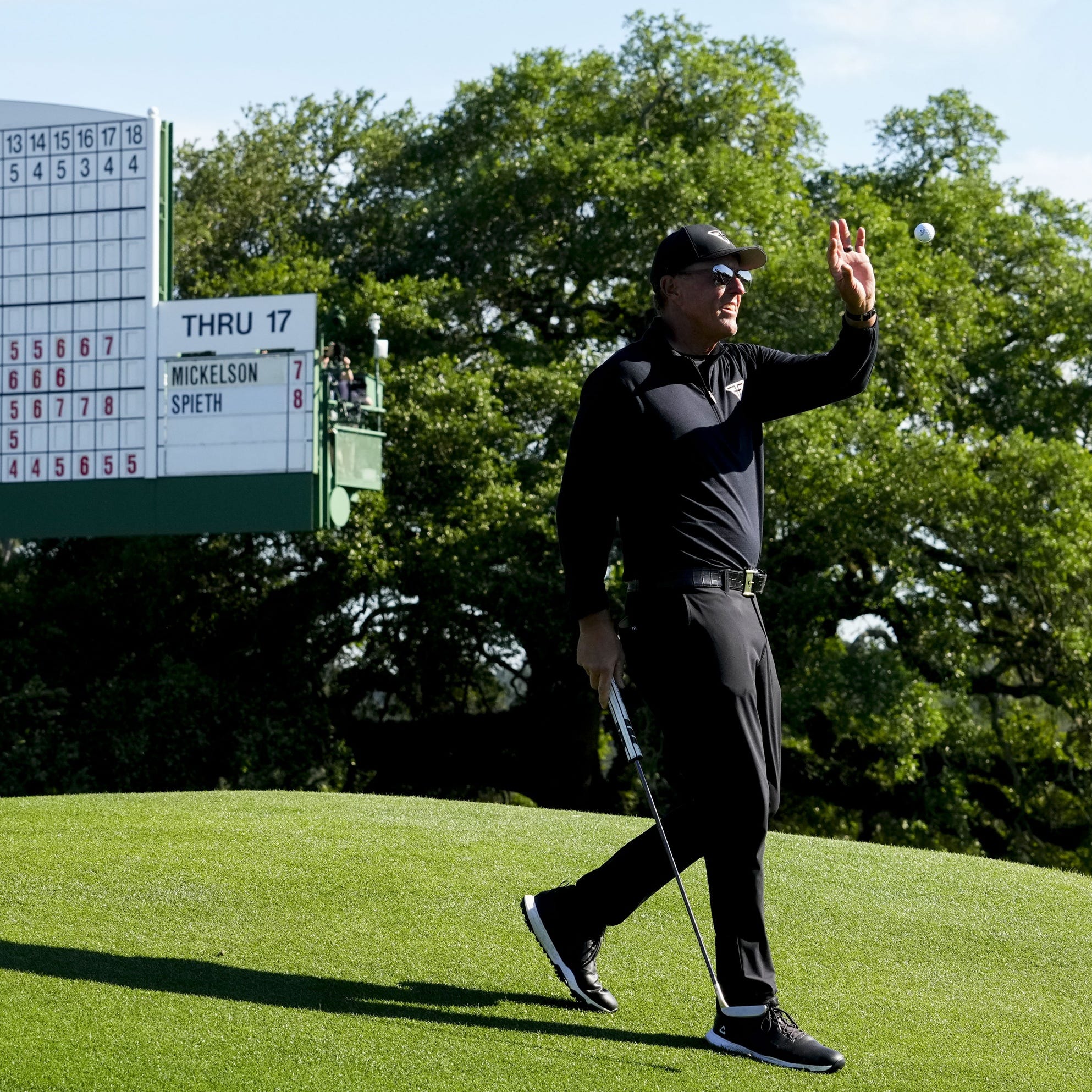 Apr 9, 2023; Augusta, Georgia, USA; Phil Mickelson catches a ball at the 18th green during the final round of The Masters golf tournament. Mandatory Credit: Rob Schumacher-USA TODAY Network