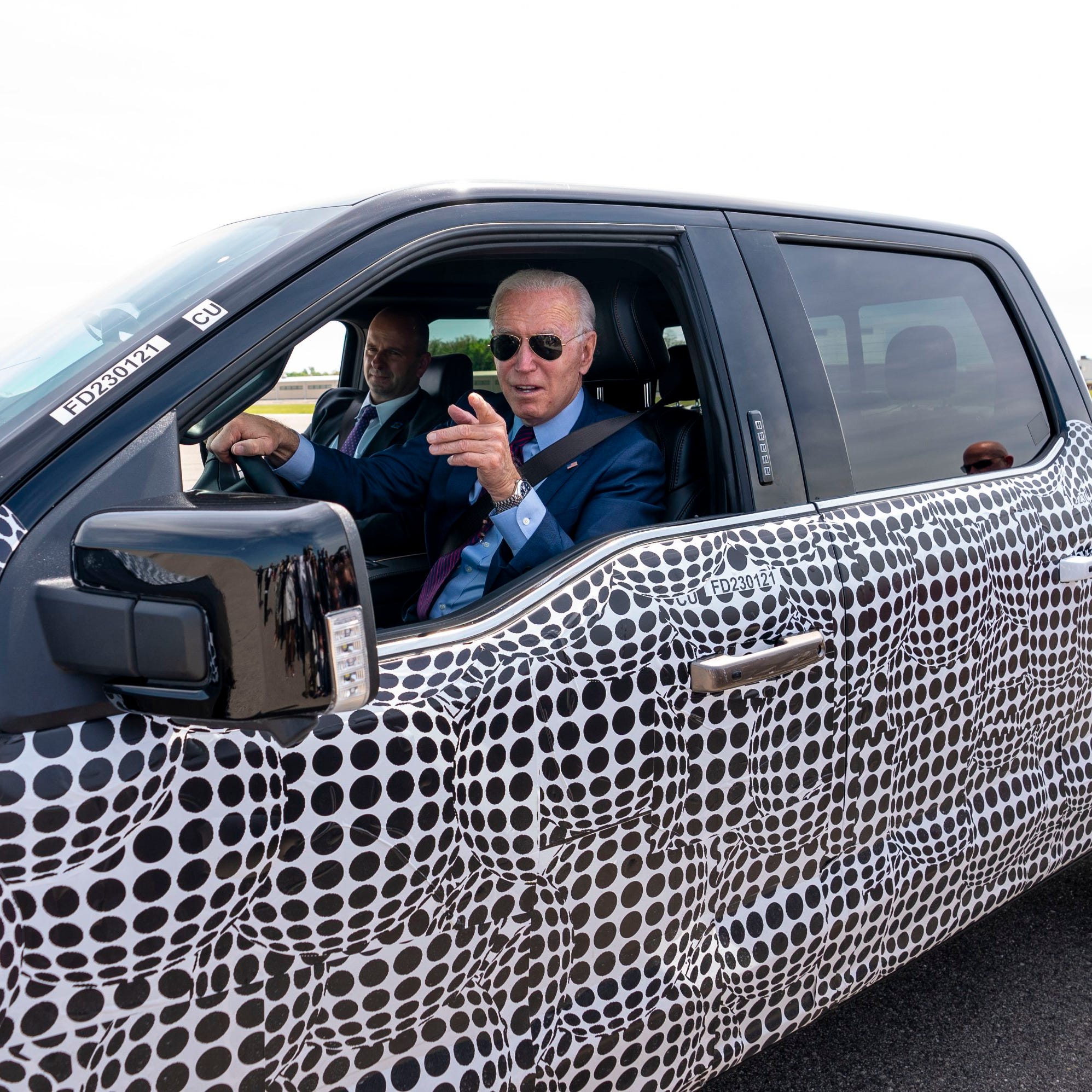 FILE Ñ President Joe Biden drives FordÕs electric pickup truck, the F-150 Lightning, at the automakerÕs development center in Dearborn, Mich., May 18, 2021. Government scientists have spent a year analyzing electric vehicles to help the Environmental Protection Agency (EPA) design new tailpipe rules to trigger an electric car revolution. (Doug Mills/The New York Times)