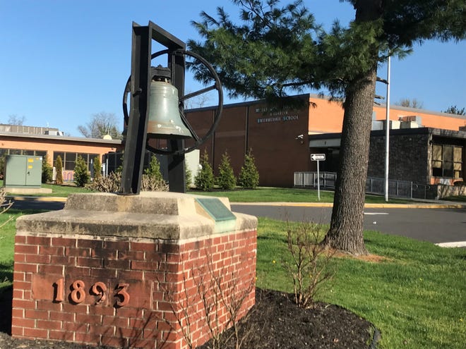 A vintage school bell monument stands in Mount Holly at the entrance to F. W. Holbein Middle School, where authorities say a student at the South Jersey school attempted suicide Feb. 6 and died two days later in Children's Hospital of Philadelphia.