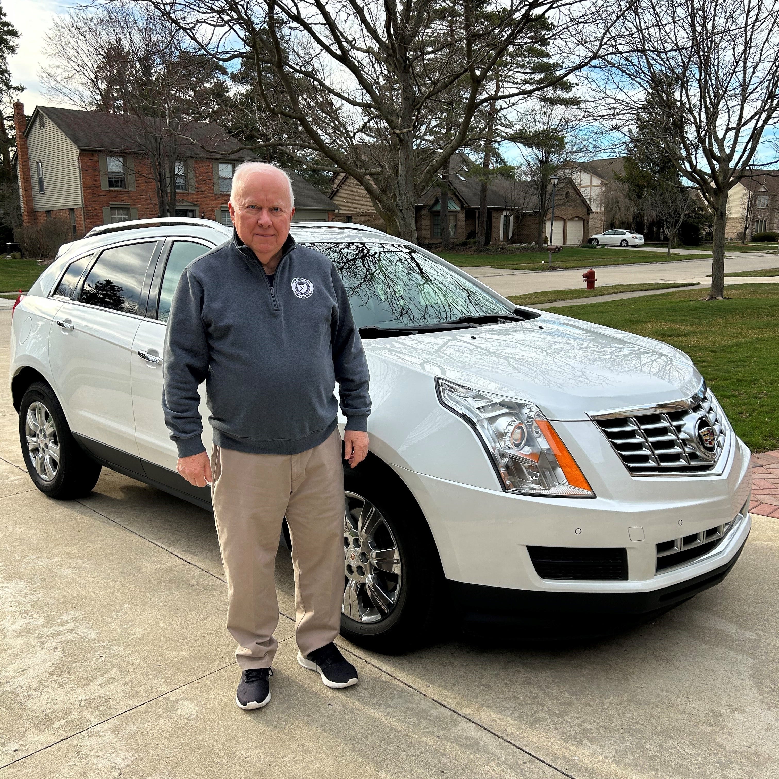 Will Lindley of Livonia was considering trading in his wife's 2016 Cadillac SRX (pictured here) for an electric vehicle, but he said it won't be a General Motors EV if it does not have Apple CarPlay.