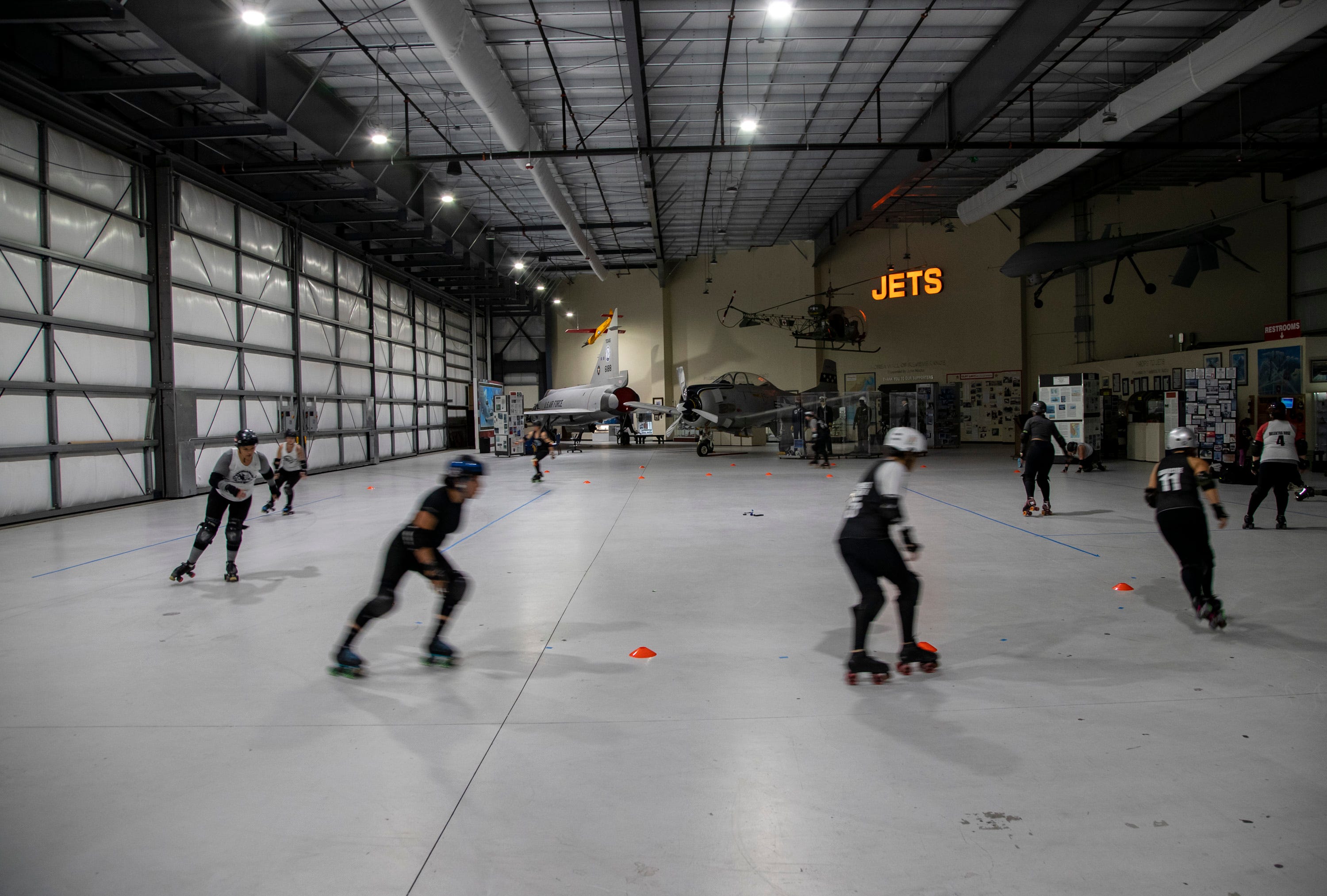 Skaters take laps to warm up before their practice at the Palm Springs Air Museum in Palm Springs, Calif., Monday, March 6, 2023. 