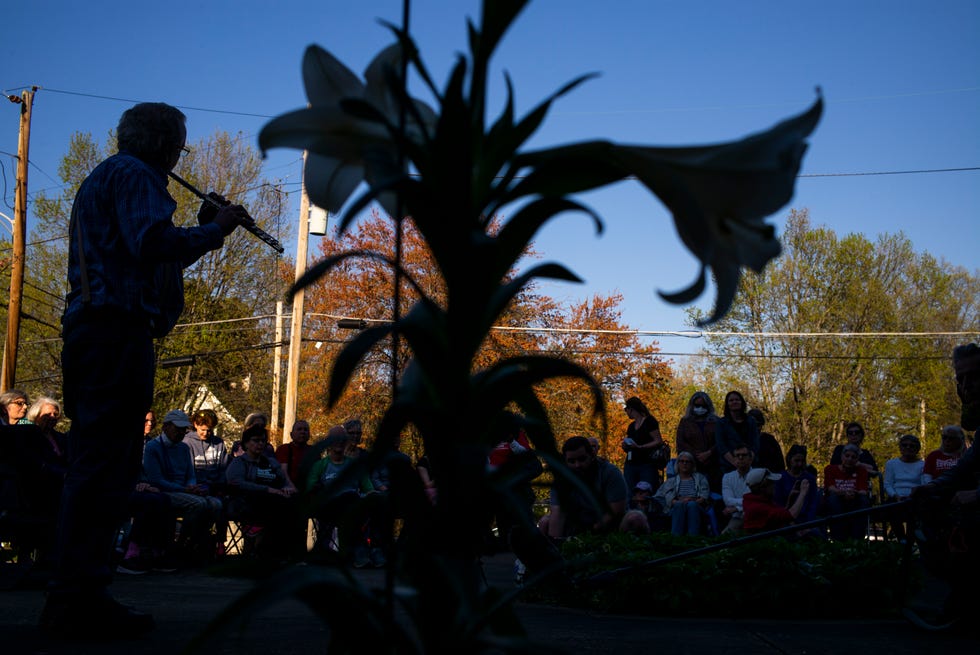 Doug Yeager plays the flute at a vigil at Crescent Hill Presbyterian Church following the mass shooting at the Old National Bank on April 10, 2023 in Louisville, Kentucky.