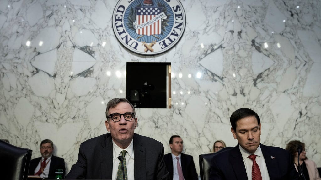 (L-R) Committee chairman Sen. Mark Warner, D-Va., and ranking member Sen. Marco Rubio, R-Fla., take their seats as they arrive for a Senate Intelligence Committee hearing concerning worldwide threats, on Capitol Hill March 8, 2023 in Washington, DC.