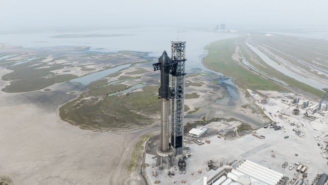 SpaceX's Starship and Super Heavy booster are seen on the company's launch mount near at Starbase, Texas, in April 2023.