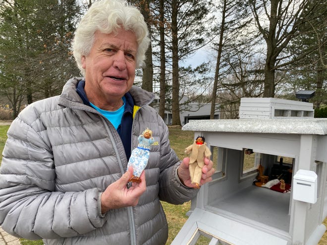 Don Powell, an Orchard Lake resident and Farmington Hills business owner, shows off his custom mailbox, where a mystery "family" showed up last August.
