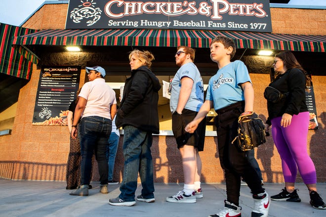 Fans line up for Chickie's & Pete's popular Crabfries during the Wilmington Blue Rocks South Atlantic League home opener against the Hickory Crawdads at Frawley Stadium in Wilmington, Tuesday, April 11, 2023. Hickory won 3-2.