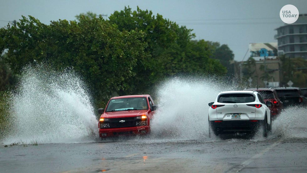 A truck drives through flooding in Little Haiti during a rain storm, Wednesday, April 12, 2023, in Miami. A torrential storm bought heavy showers, gusty winds and thunderstorms to South Florida on Wednesday and prompted the closure of Fort Lauderdale-Hollywood International Airport and the suspension of high-speed commuter rail service in the region.
