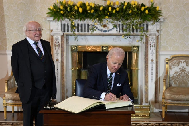President Joe Biden celebrates the 25th anniversary of Irish President Michael D. Higgins during his four-day visit to Northern Ireland and Ireland at Arras-an-Wachtaline, Dublin, April 13, 2023. Sign the guestbook while you wait. "good friday pact".